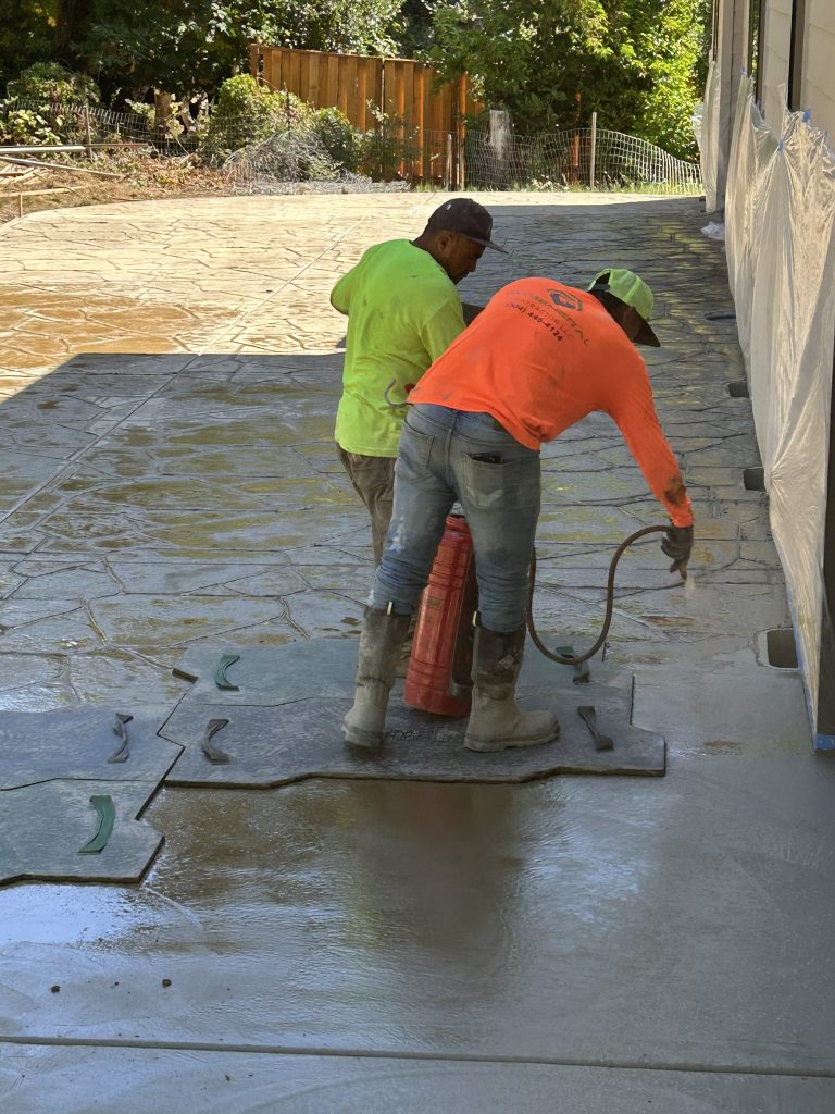 Concrete crew placing a new slab in Portland