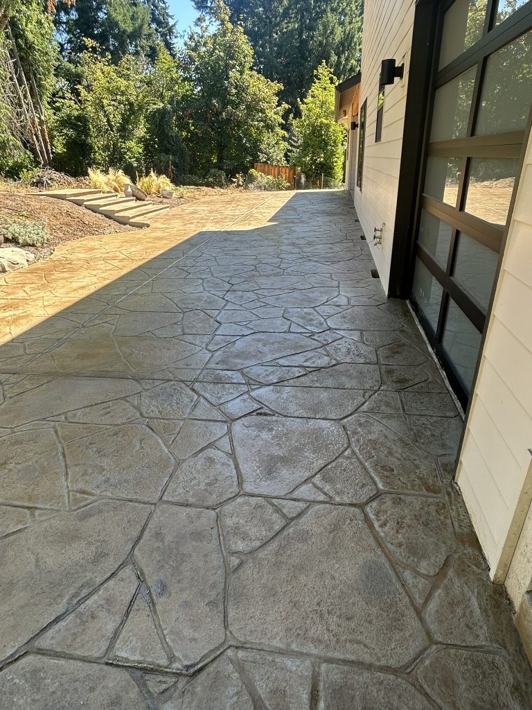 Decorative stamped concrete patio next to a home